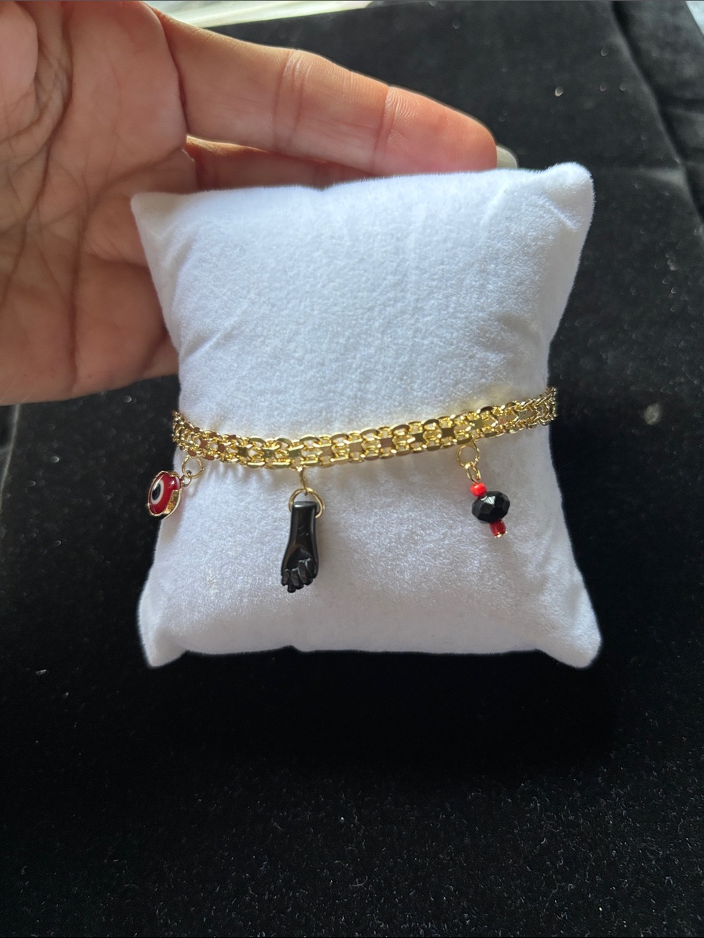 Gold Charm Bracelet with Black Hand and Bead Accents